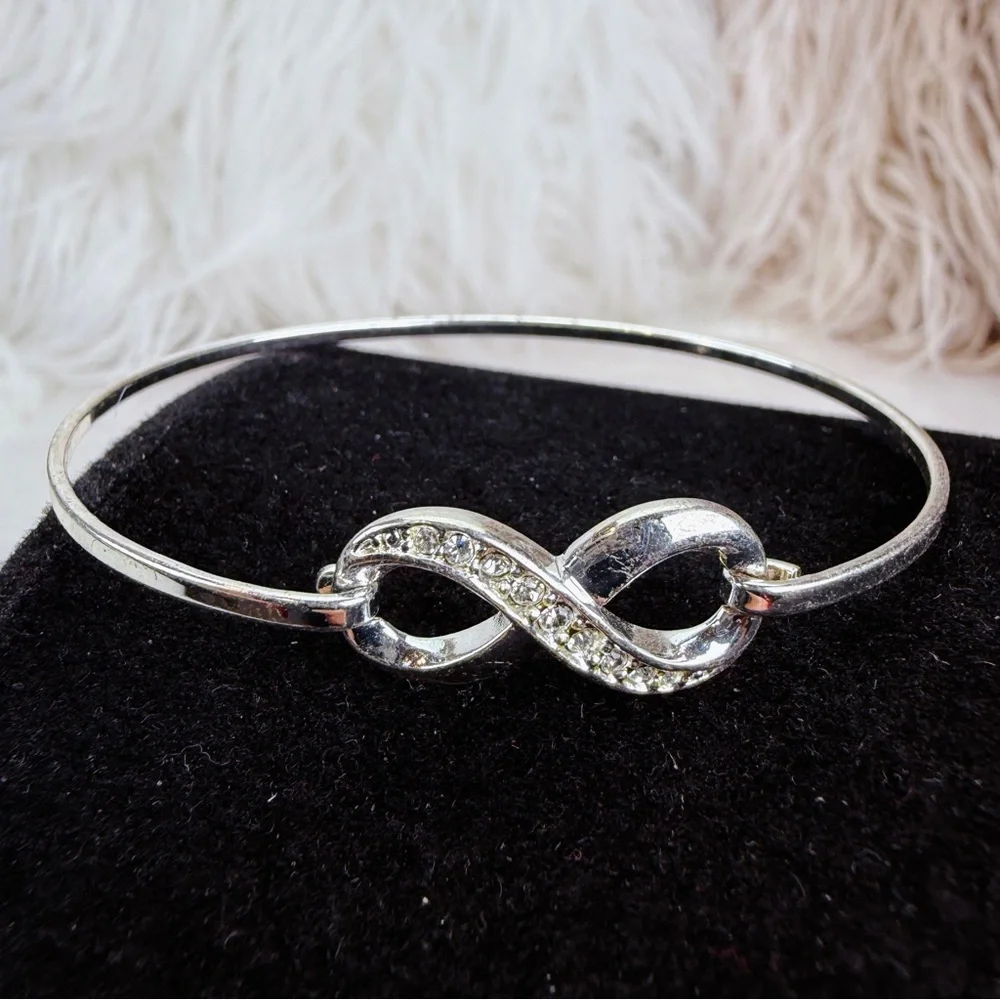 Silvertone bling accent Infinity Bracelet - Picture 3 of 11